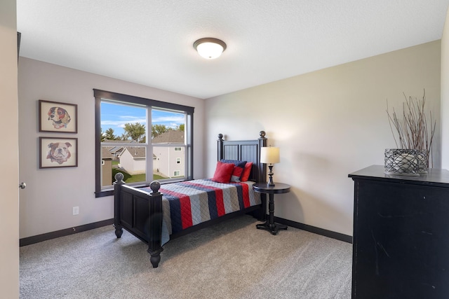 bedroom featuring light colored carpet