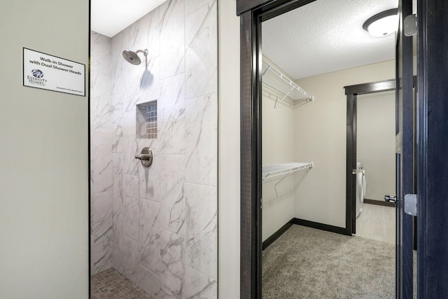 bathroom with a tile shower