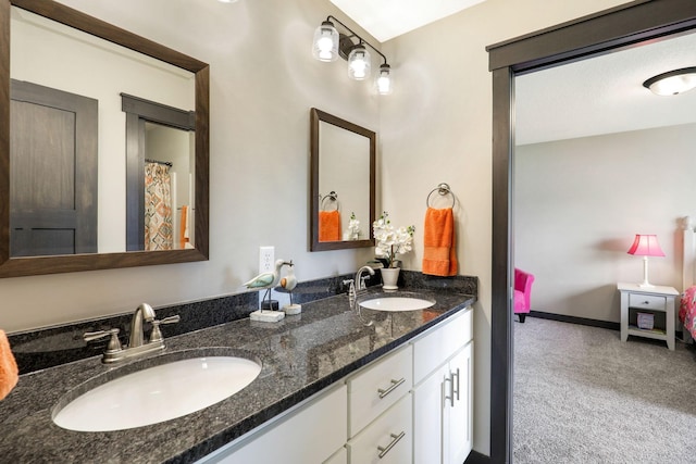 bathroom featuring large vanity and dual sinks