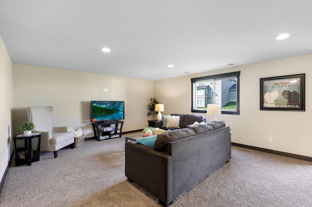 living room with a textured ceiling and light colored carpet