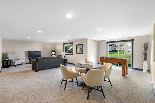 dining space featuring light colored carpet