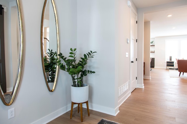 hallway with light wood-type flooring