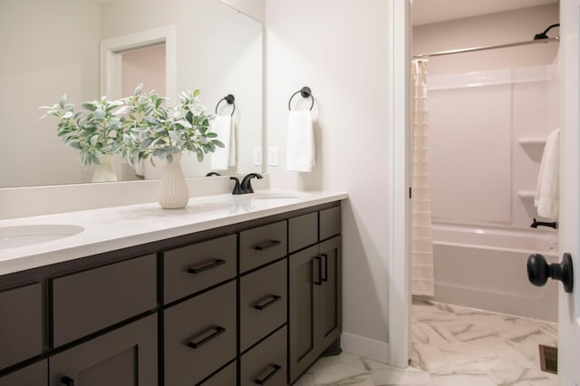 bathroom featuring vanity and shower / tub combo