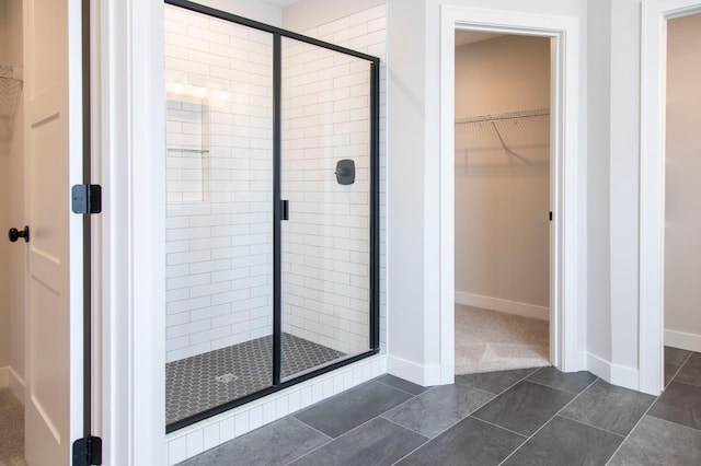 bathroom featuring tile patterned floors and an enclosed shower