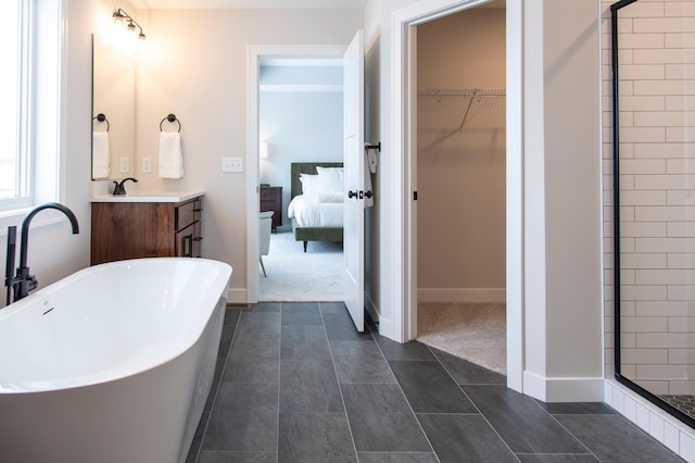 bathroom featuring vanity and plus walk in shower