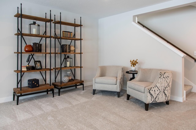 living area featuring light colored carpet