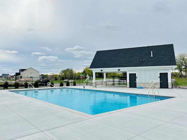 view of swimming pool with a patio