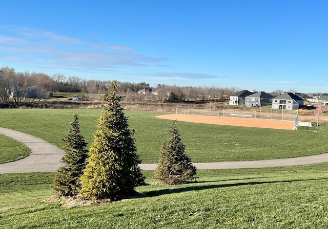 view of property's community with a lawn