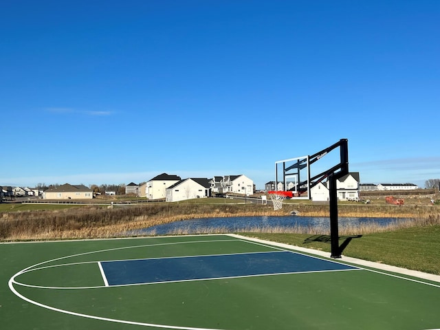 view of basketball court with a residential view and community basketball court