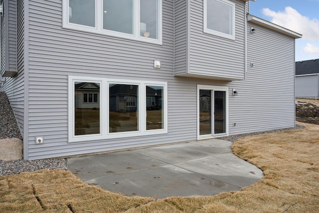 rear view of property featuring a patio area