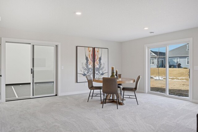 dining space featuring carpet, baseboards, and recessed lighting