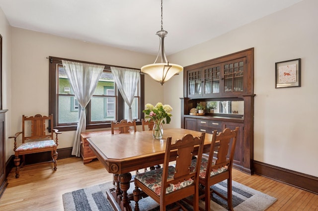 1503 Sheridan Ave N, Minneapolis, MN 55411 - dining room with light wood-style flooring and baseboards