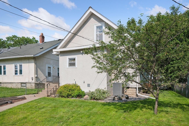 1503 Sheridan Ave N, Minneapolis, MN 55411 - back of property with stucco siding and a chimney