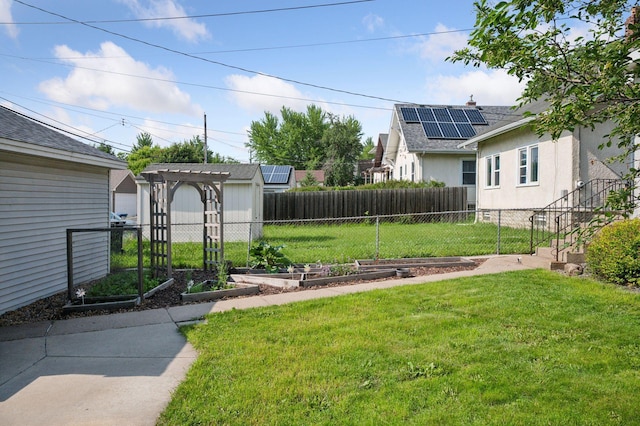 1503 Sheridan Ave N, Minneapolis, MN 55411 - view of yard featuring a garden and a storage shed