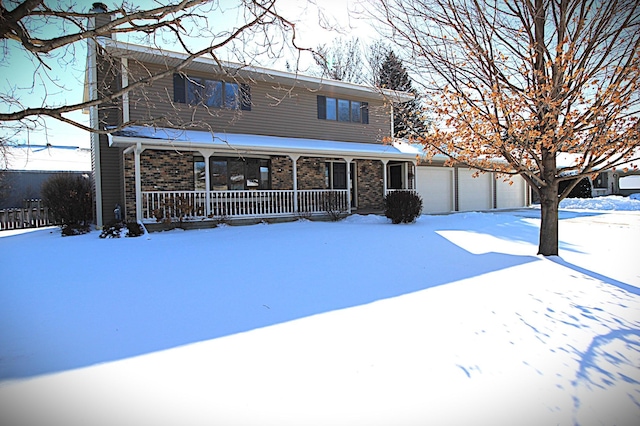 view of front of property featuring a garage and a porch