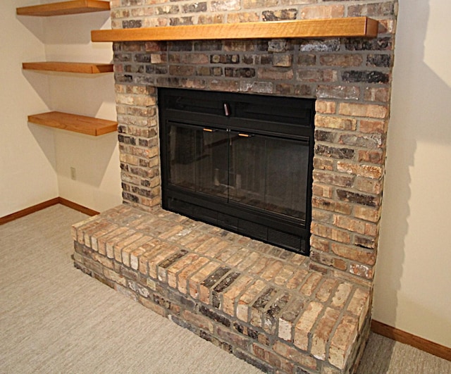 interior details featuring carpet flooring and a fireplace