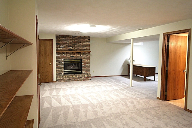 basement with a brick fireplace and light carpet