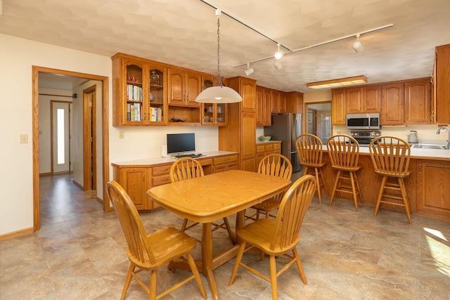 dining room featuring sink and built in desk