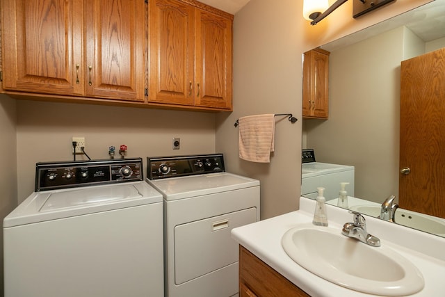 washroom featuring sink and independent washer and dryer