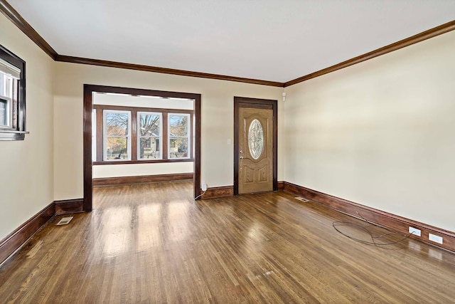 entryway featuring ornamental molding and dark wood-type flooring