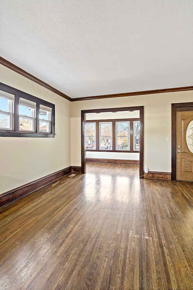 interior space featuring hardwood / wood-style floors, a healthy amount of sunlight, and a textured ceiling