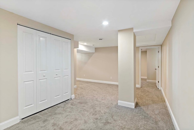 basement with light colored carpet