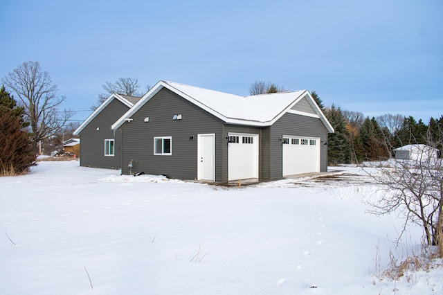 view of snow covered garage