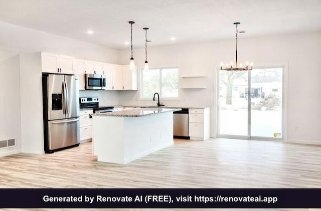 kitchen featuring white cabinetry, light hardwood / wood-style floors, appliances with stainless steel finishes, light stone countertops, and a center island