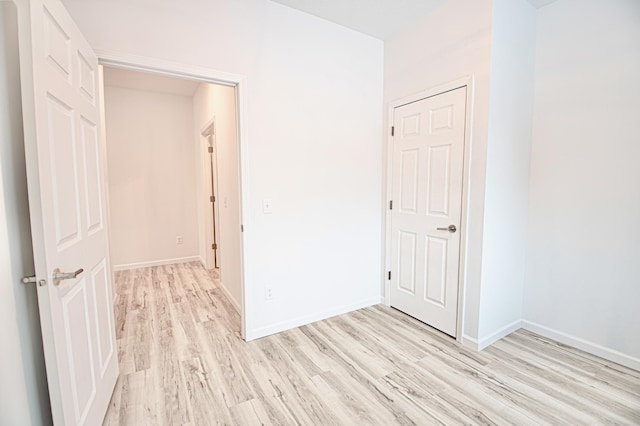 unfurnished room with light hardwood / wood-style flooring