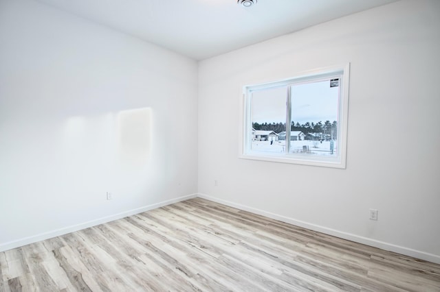 empty room with light wood-type flooring