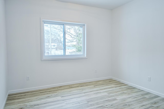 spare room featuring light hardwood / wood-style flooring