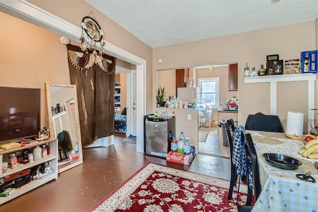 office space featuring a notable chandelier, a textured ceiling, and dark hardwood / wood-style flooring