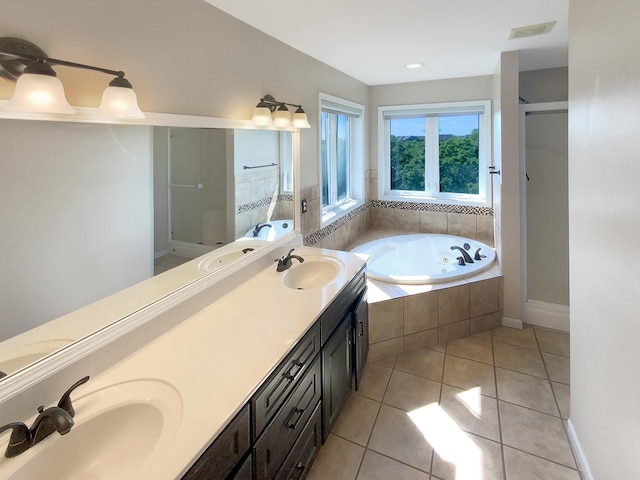 bathroom featuring vanity, separate shower and tub, and tile patterned floors