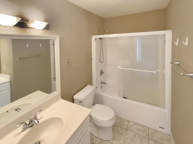 full bathroom with vanity, toilet, bath / shower combo with glass door, and tile patterned flooring