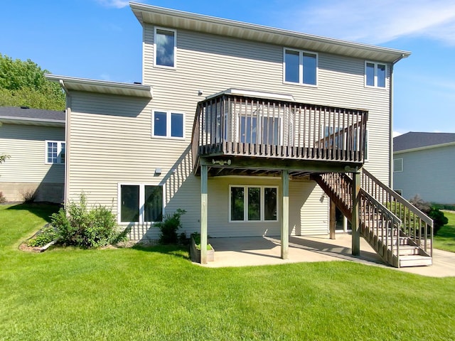 back of house featuring a wooden deck, a yard, and a patio