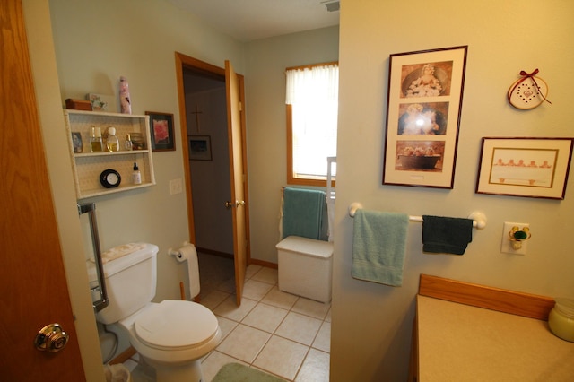 bathroom with tile floors and toilet