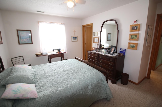 bedroom with ceiling fan and carpet