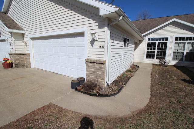 view of side of home featuring a garage