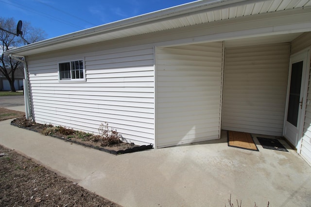 view of side of home with a patio area