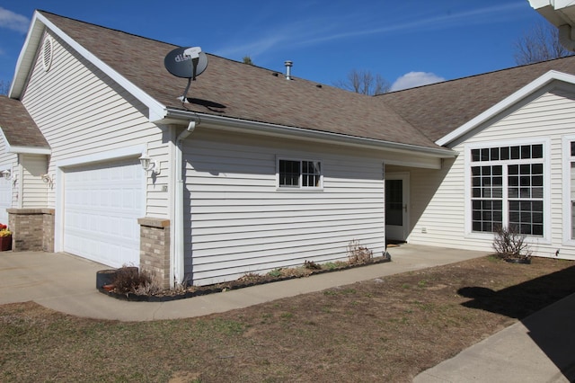 view of side of home featuring a garage