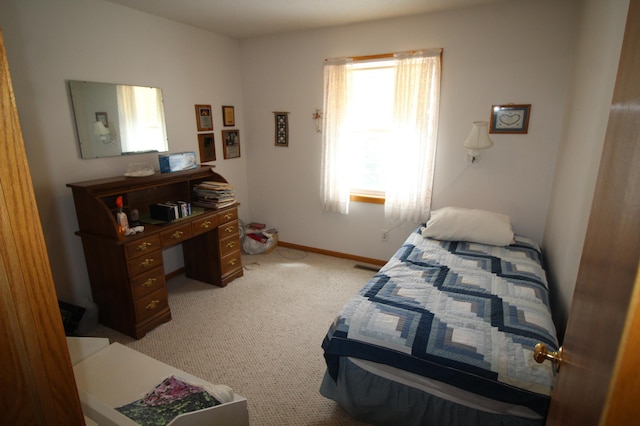 bedroom featuring light carpet