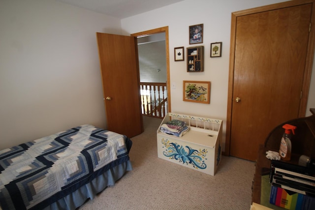 carpeted bedroom with a closet