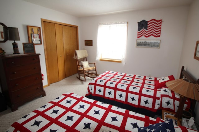 bedroom with light carpet and a closet