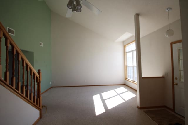 interior space with high vaulted ceiling and ceiling fan