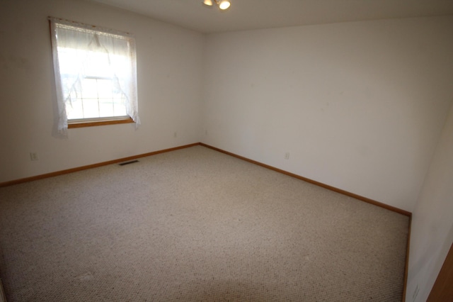 unfurnished room with carpet flooring