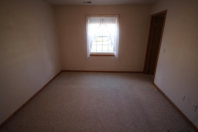 view of carpeted spare room