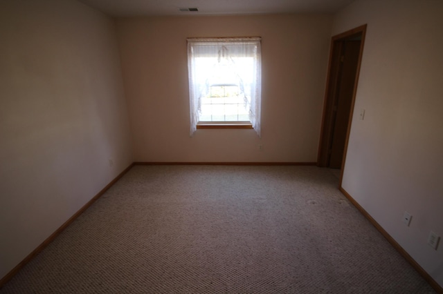 view of carpeted spare room