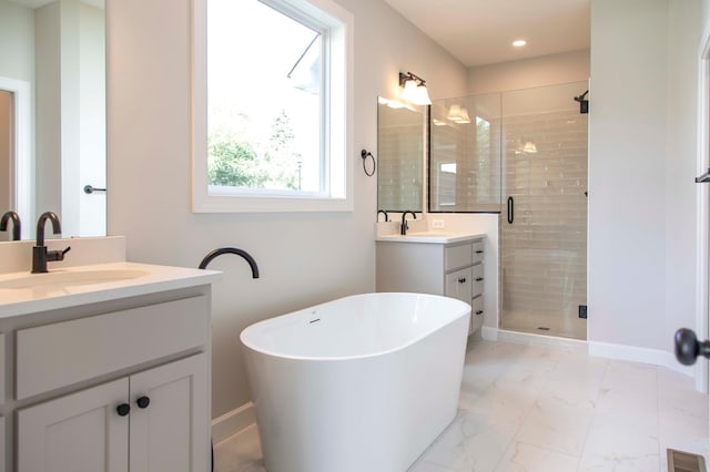 bathroom with independent shower and bath and vanity