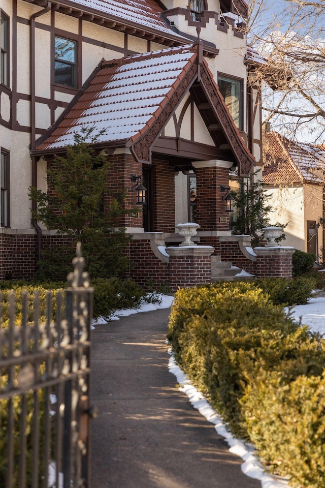 view of snow covered property entrance