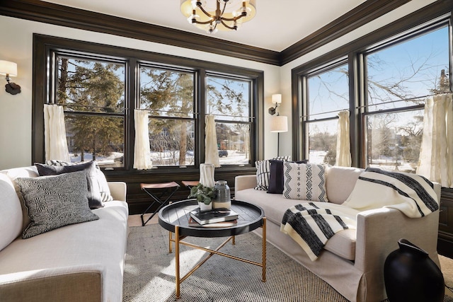 sunroom / solarium with a notable chandelier